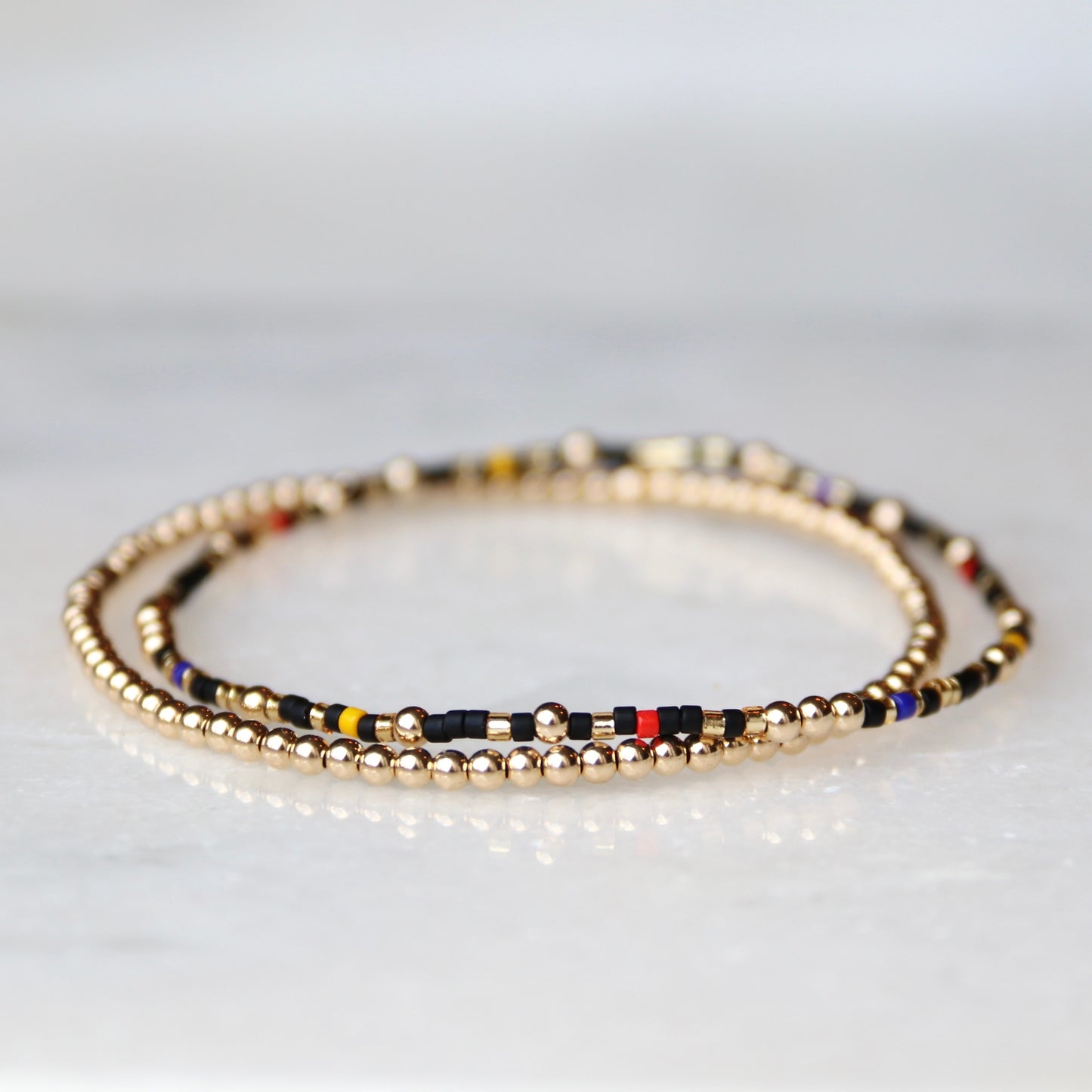 Black, Gold, Blue, Yellow & Red